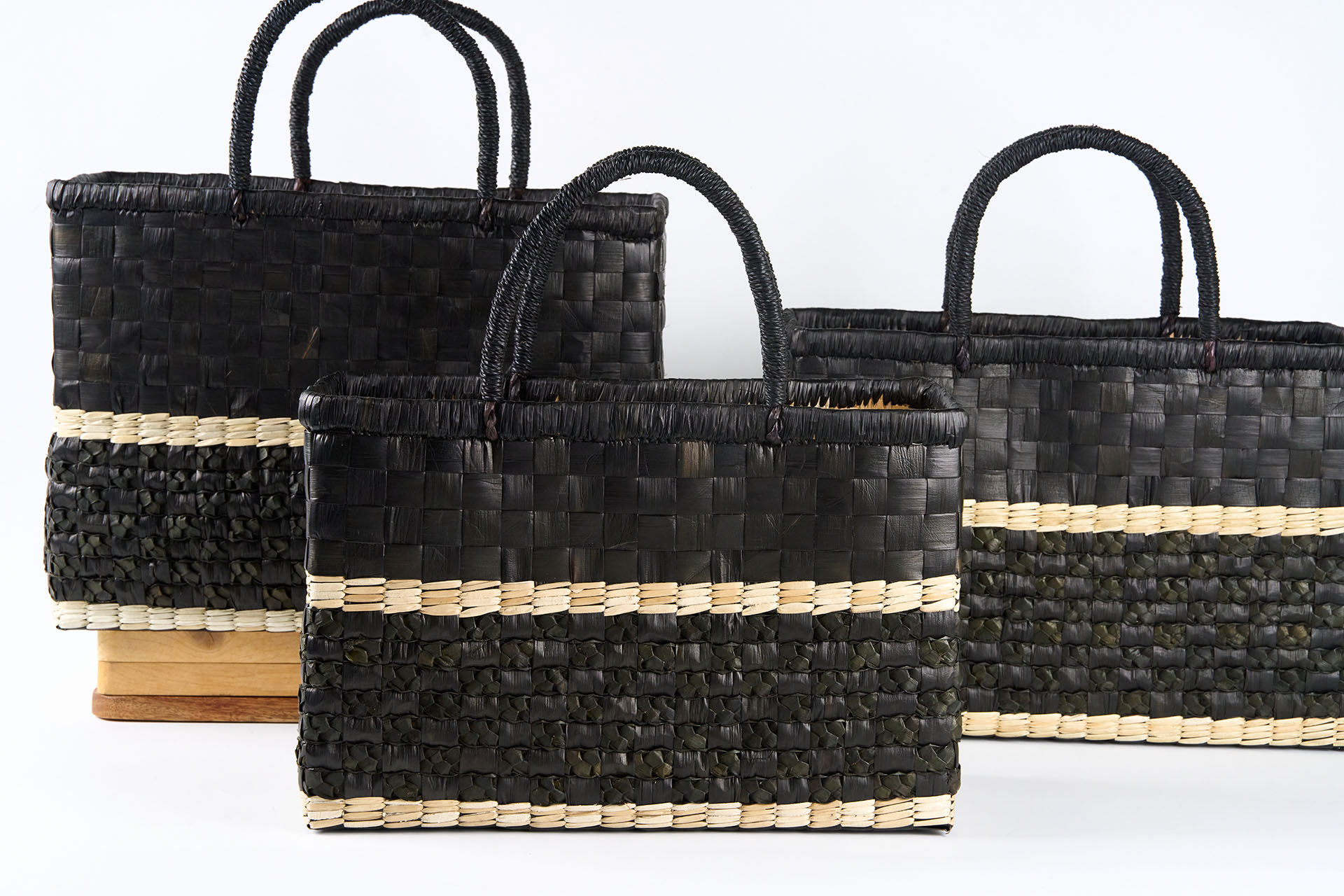 Handwoven black and natural bayong bags by Sto. Niño de Plaridel Multi-Purpose Cooperative